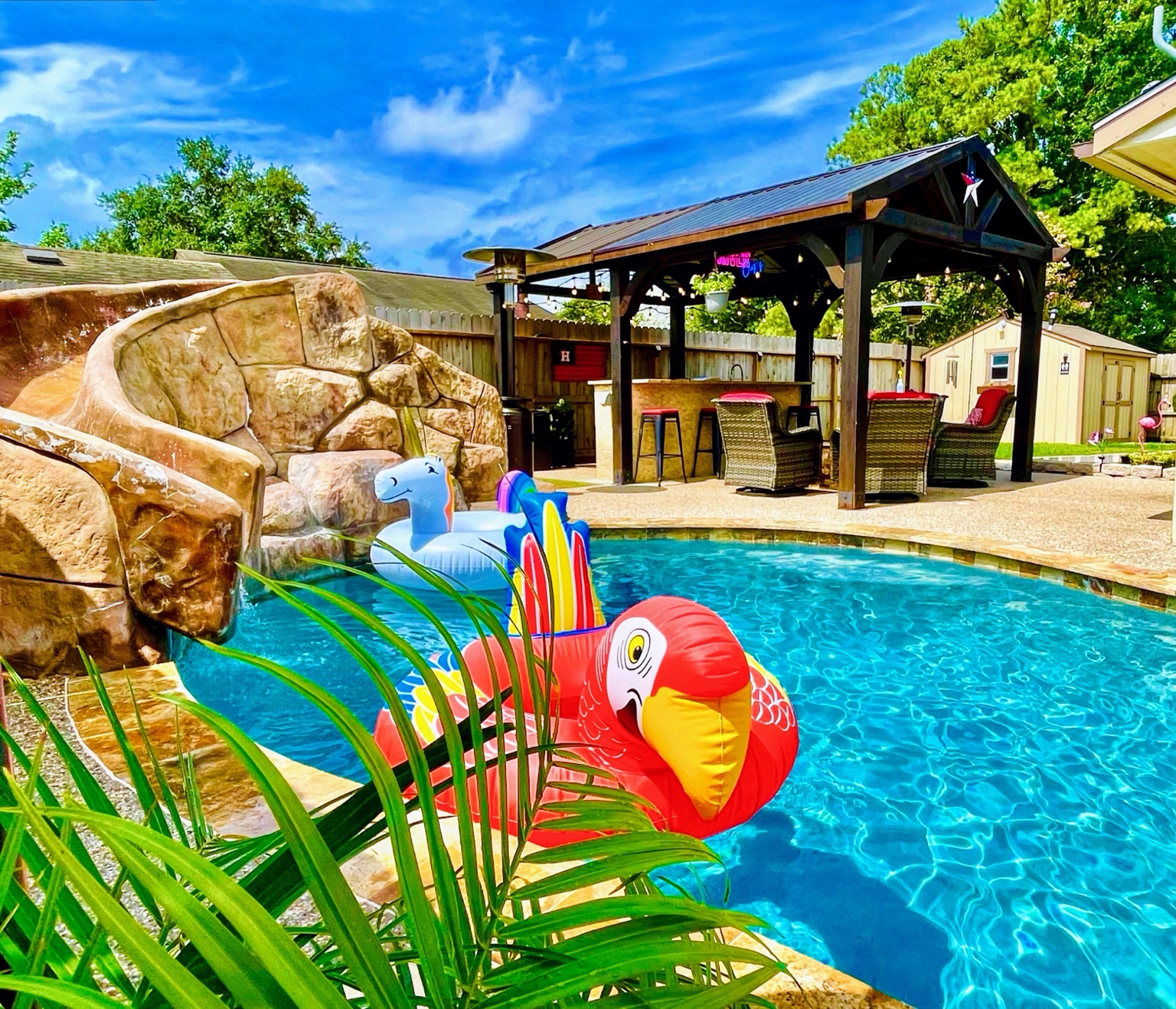 Cypress River Oasis private pool, rock slide and covered gathering area