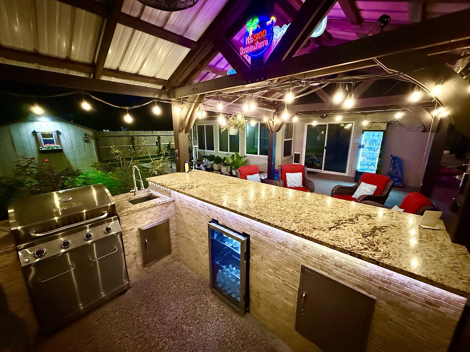 Granite bar, sink, refrigerator, and grill