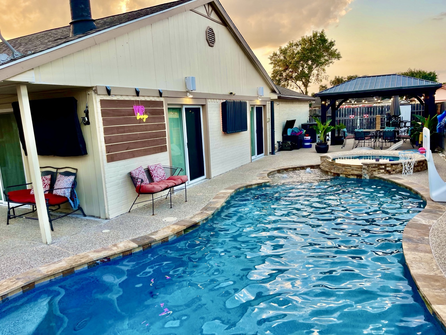 Bright real view of Cypress River Oasis pool and venue
