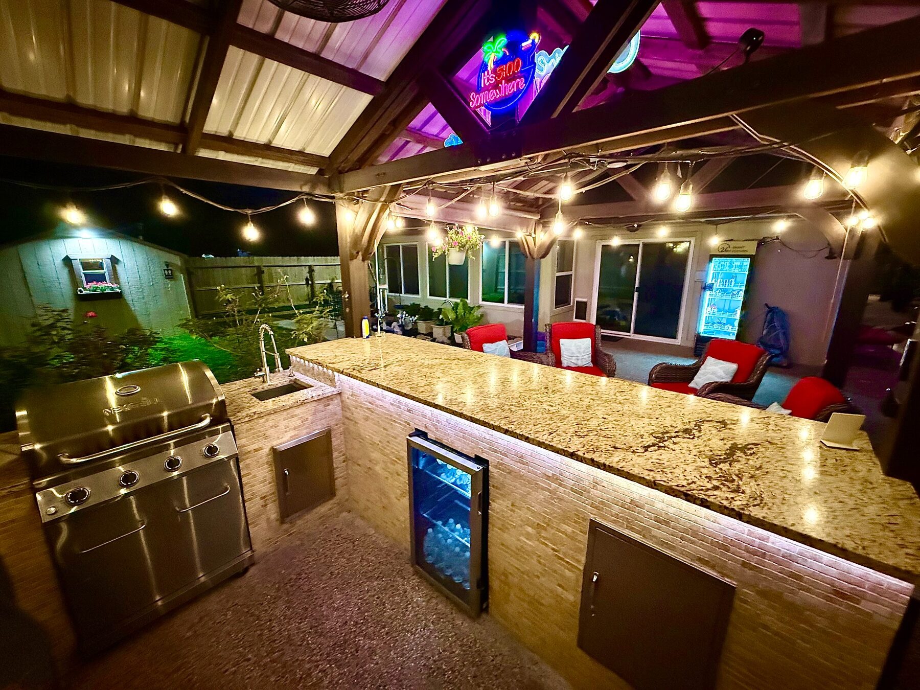 Granite bar and grill area beneath a covered gazebo