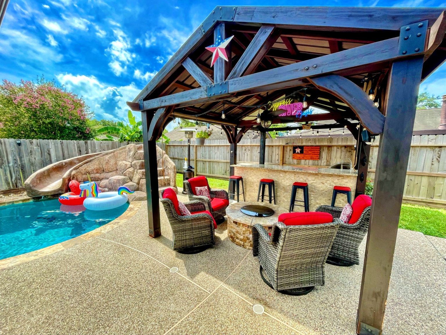 Covered gazebo, granite bar and pool seating