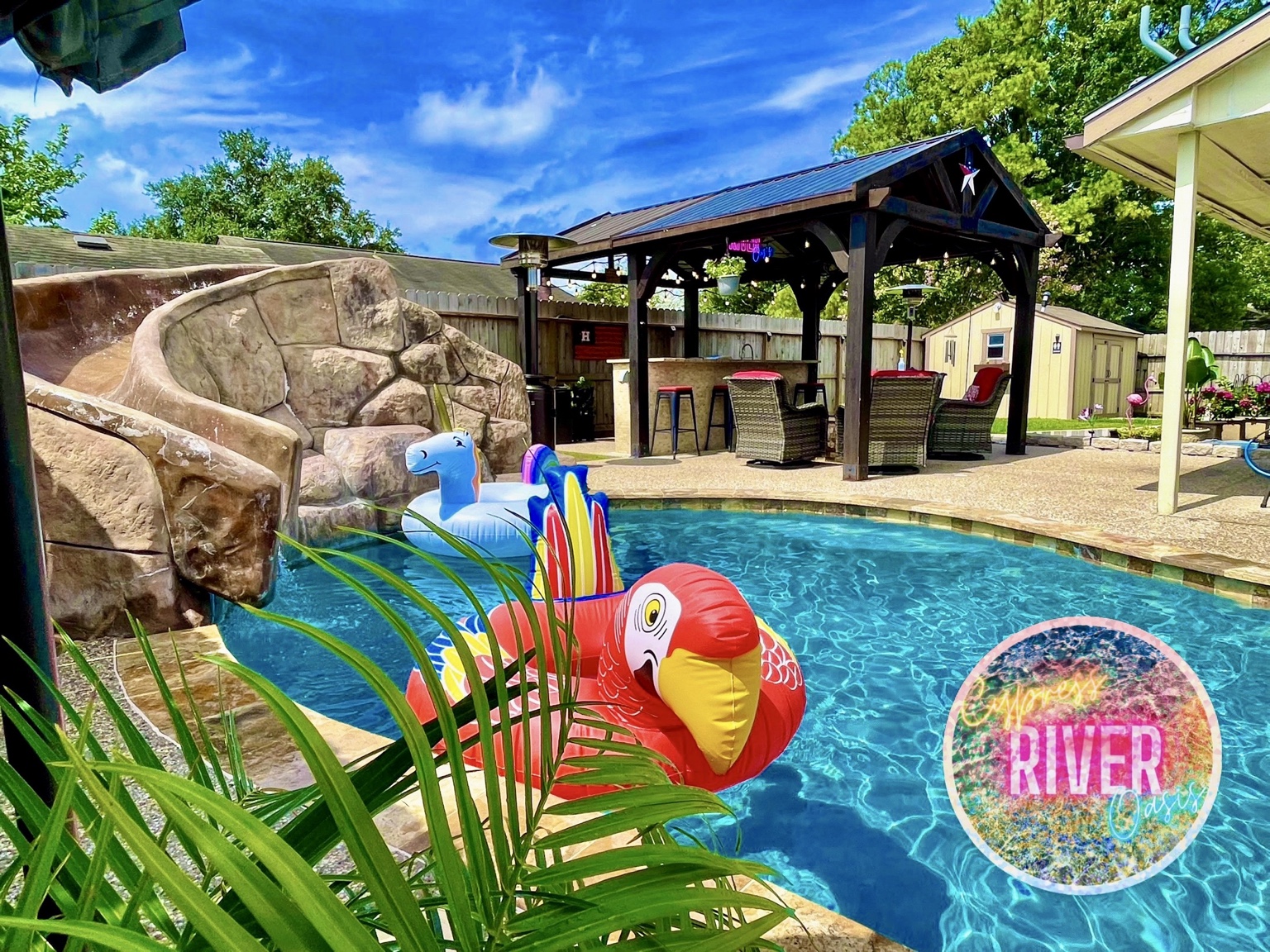 Pool waterfall, rock waterslide and covered gazebo